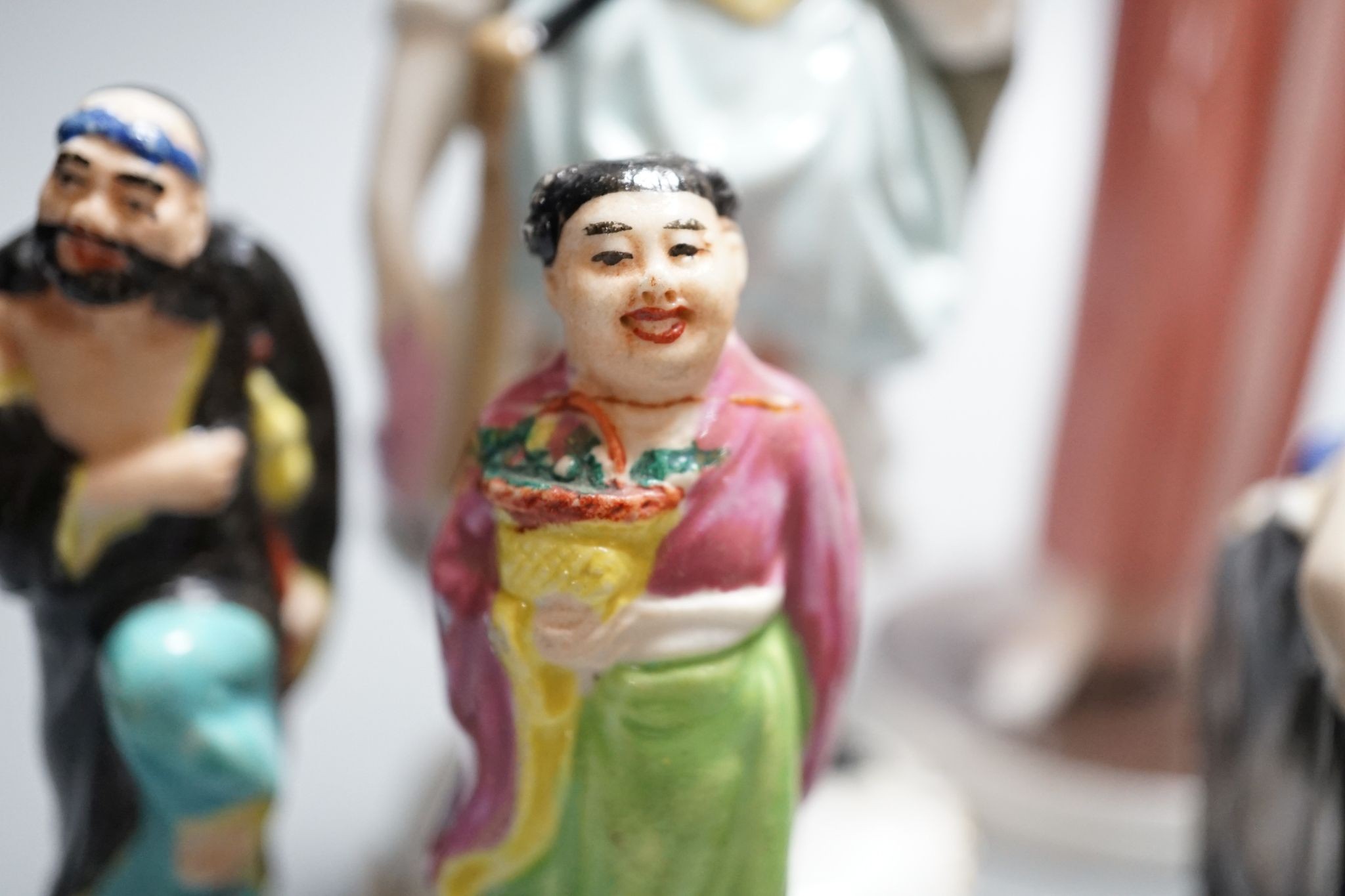 A set of twelve Chinese miniature porcelain figures, tallest 8cm, other ceramic figures, etc.